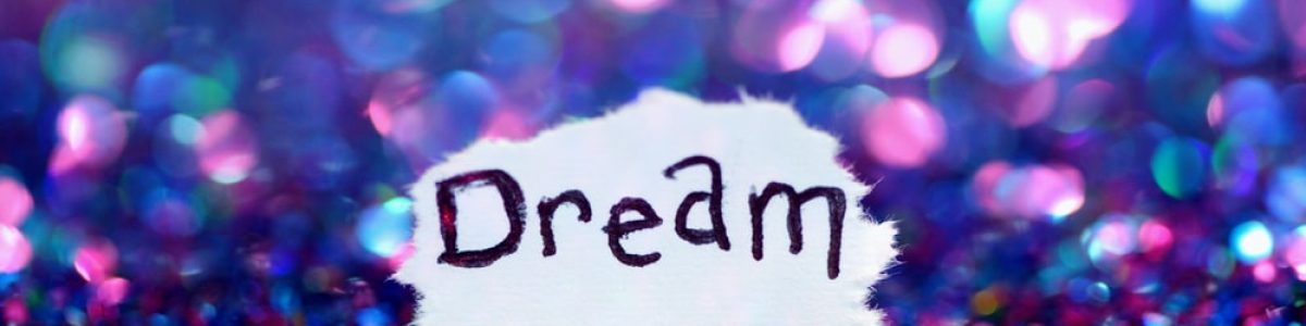 Word dream surrounded by sparkles